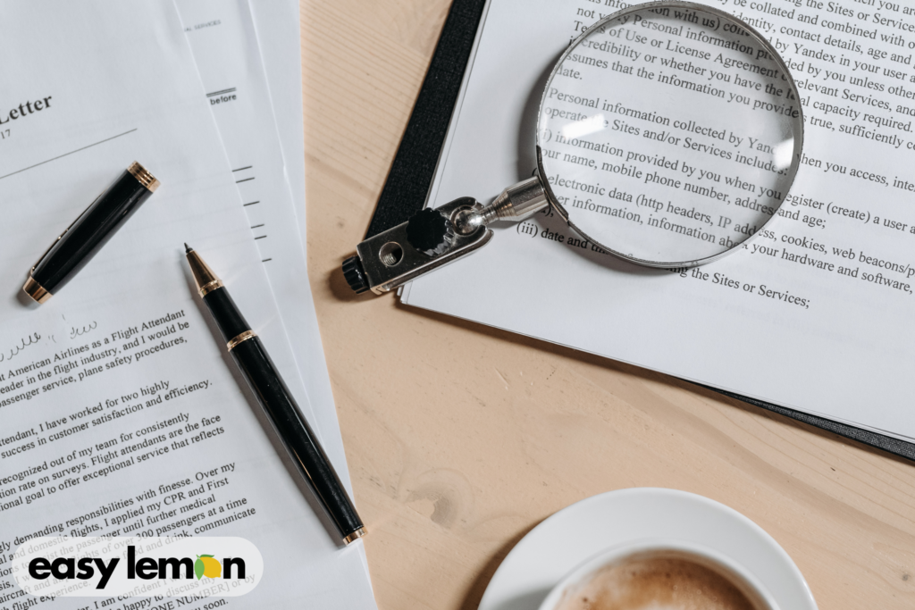Magnifying glass reviewing legal documents to illustrate hidden rights and protections available to consumers under lemon law.