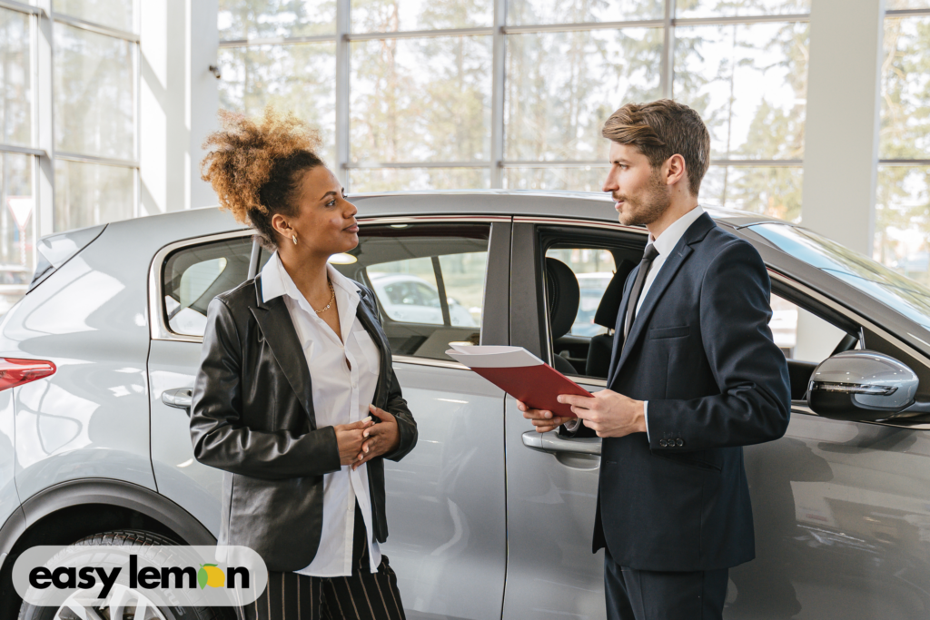 Truck owner speaking with a dealership service advisor about ram truck recall lemon law rights after failed repairs.